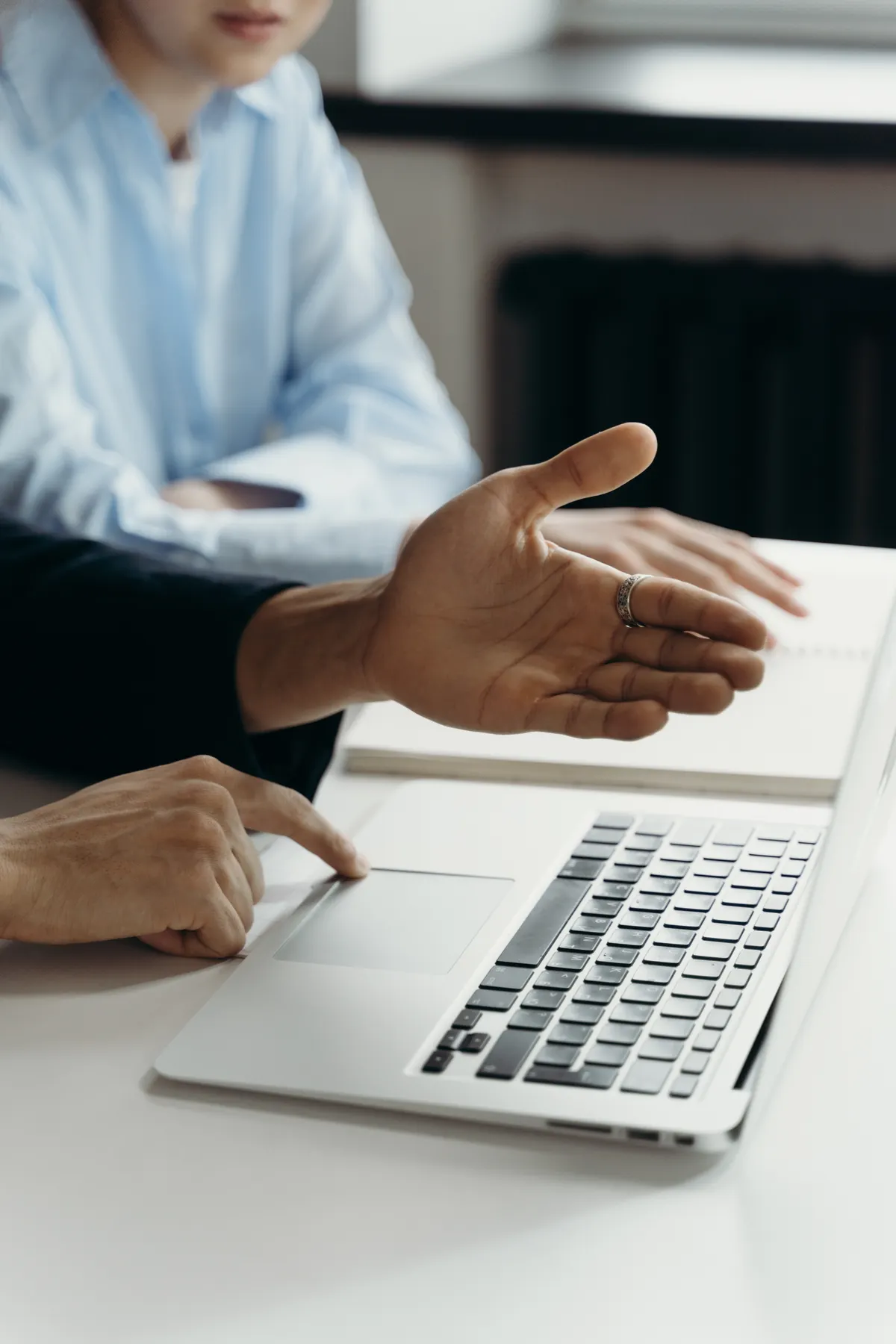 Colleagues reviewing information together on a laptop