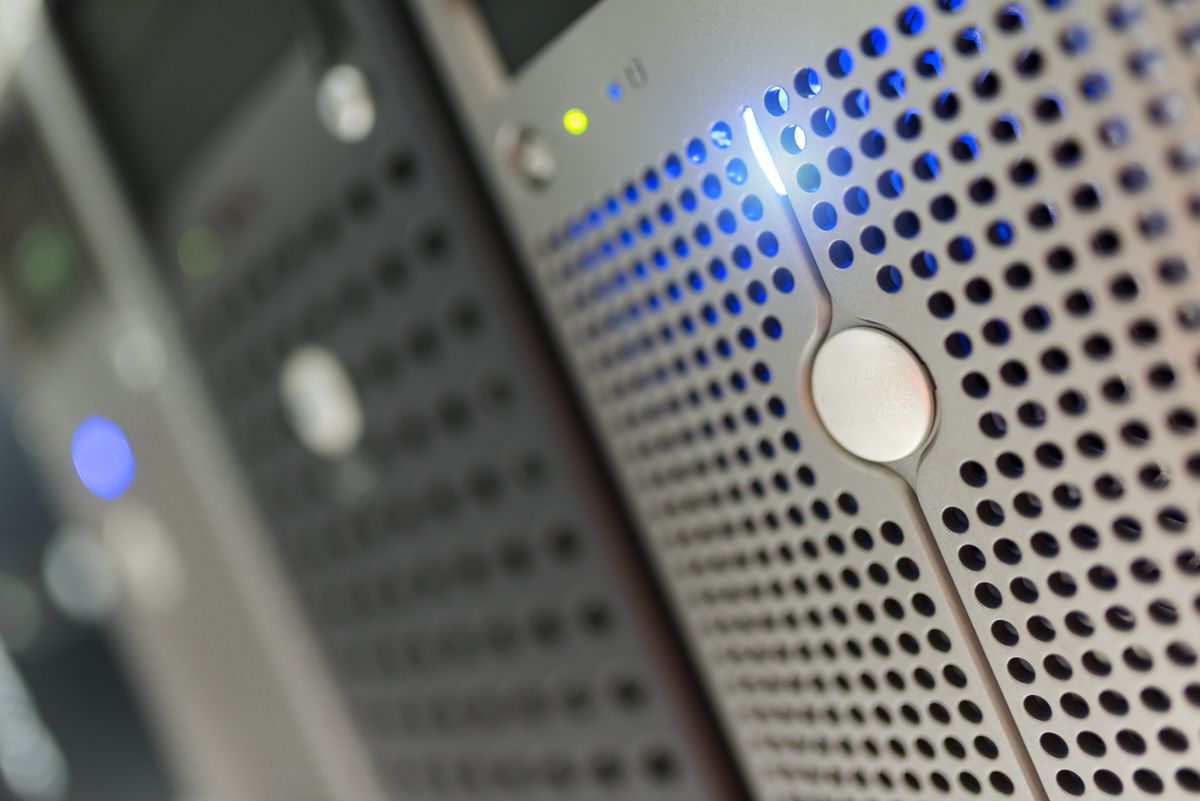 Close detail of server hardware with blue status lights